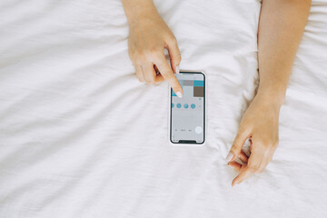 close-up image of women's hands using a smartphone during the day on a city street. Concept search or social networks, bloggers.