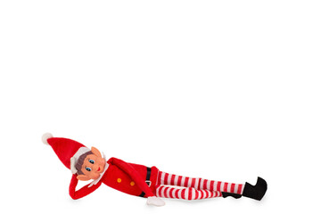 Christmas Elf toy on an isolated white background with copy space. Christmas spirit, Christmas shelf tradition. - obrazy, fototapety, plakaty