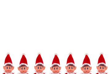 Christmas Elf toy peeking heads on an isolated white background with copy space. Christmas spirit,...