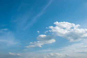 Obraz premium Blue sky background with tiny clouds.