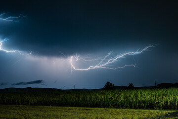 Lightning discharge in the air over a corn field in rural Transylvania, Romania