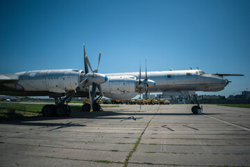 Fototapeta na wymiar Old plane. Hull, chassis, engines and propellers of an old plane. large, cargo, military aircraft with a large payload