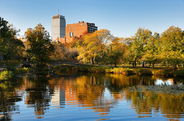 Fototapeta premium Boston Skyline at Autumn showing Charles River Esplanade at early morning with fall foliage. The Charles River Esplanade of Boston, MA, is a state-owned park in the Back Bay area of the city.