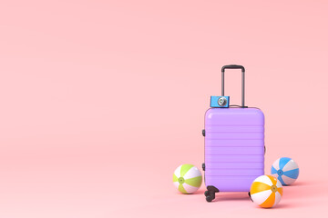 Suitcase with beach ball and flip flops on pink background.