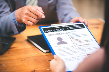 Woman submits her employer's resume to review job applications. Concept showcases her ability to get the company to agree on the position.