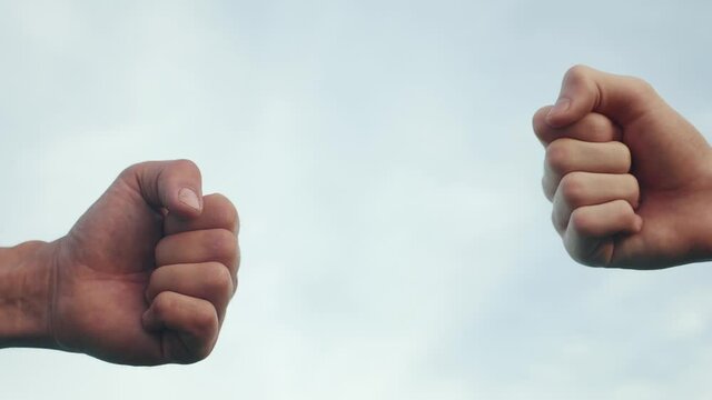 teamwork concept. fist to fist commit solidarity respect and brotherhood gesture. business team hands fists close-up. people of different skin colors partnership friendship lifestyle teamwork