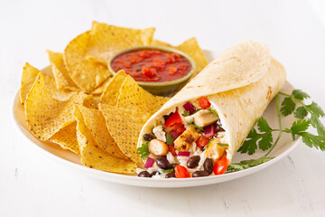 Chicken burrito with yellow corn tortilla chips
