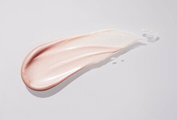 Light pink beige high lighter makeup smear of creamy luminous blusher background