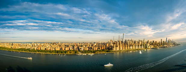 Aerial panorama of the entire New York City waterfront skyline at sunset