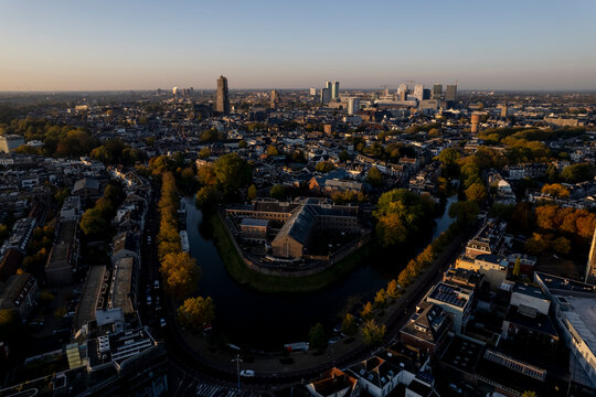 Cityscape Skyline Of Medieval City Utrecht In The Netherlands With De Lik Former Prison Wolvenburg Correction Facility Along Canal In The Foreground In Autumn Sunrise