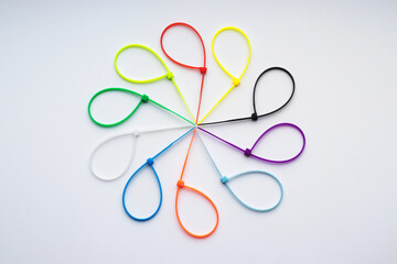 Multicolored plastic cable ties arranged in a circle