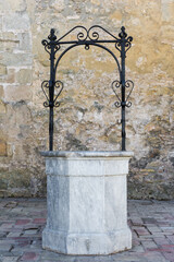 Medieval, stone water well in Vejer de la Frontera. Cadiz, Andalusia, Spain