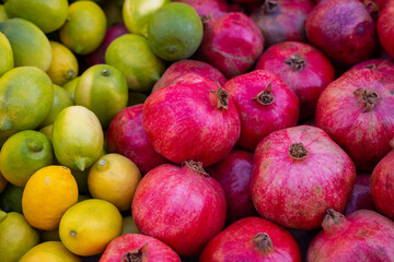 fresh pomegranates and lemons in the market