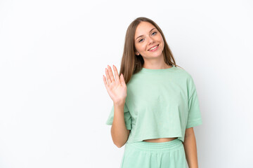 Obraz na płótnie Canvas Young Lithuanian woman isolated on white background saluting with hand with happy expression