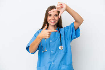 Young surgeon doctor Lithuanian woman isolated on white background focusing face. Framing symbol