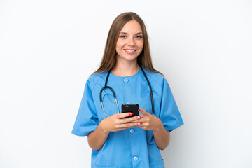 Young surgeon doctor Lithuanian woman isolated on white background sending a message with the mobile