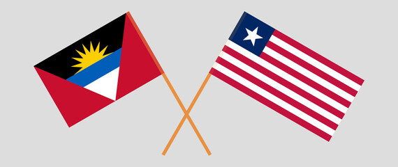 Crossed flags of Antigua and Barbuda and Liberia. Official colors. Correct proportion