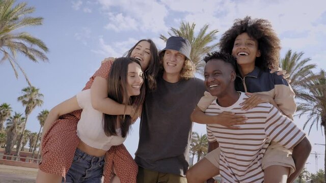 Group of young people of different races laughing and having fun outdoors. Concept of vacation, having fun, free time, summer.