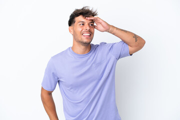 Fototapeta premium Young caucasian handsome man isolated on white background smiling a lot