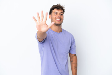 Young caucasian handsome man isolated on white background counting five with fingers