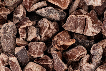Pieces of broken cocoa beans - also called chocolate nibs, detail under microscope image width 23mm