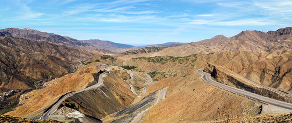 Panorama of Tizi n'Tichka mountain pass in High Atlas range, Morocco - serpentine curved roads over...