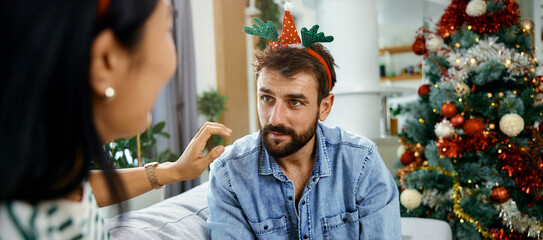 a cheerful young couple having fun during the Christmas holidays