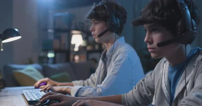 Young gamers playing video games together
