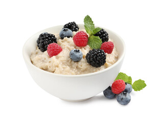 Tasty oatmeal porridge with blackberries, raspberries and blueberries in bowl on white background