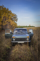 Russian SUV in autumn in nature