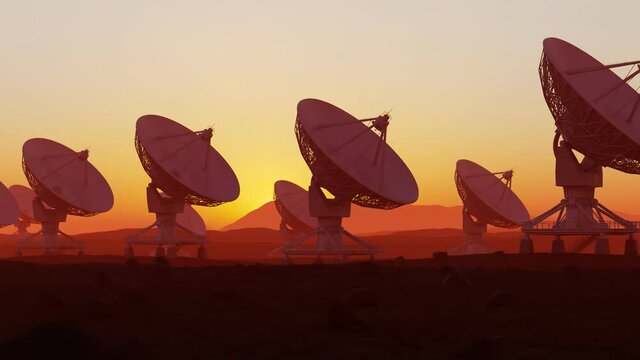 Set of satellite dishes in the desert at sunset. Space observatory signal search