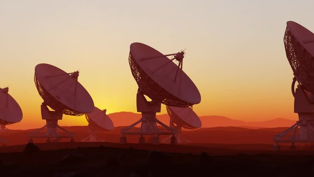 Set of satellite dishes in the desert at sunset. Space observatory signal search