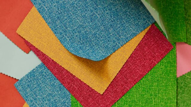 Animation with a set of fabric samples. Square pieces of multiclour materials.
