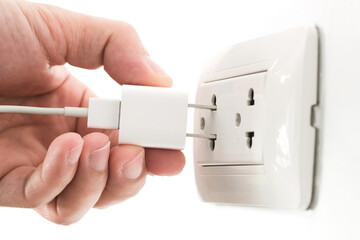 Hand of Electrical Appliances He was pulling the plug. Out of the plug. In his office during work hours. Energy Saving Concepts and Technologies