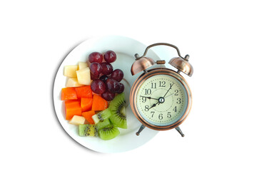 Antique clock needles Fruit on isolated white background . Healthy food concept.