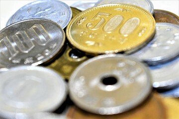 Closeup of Japanese Yen coins collection with 500 yen coin, 100 yen coin, and other coin denominations