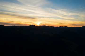 Silhouette of mountain landscape at sunset. Drone photography