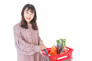 Obraz na płótnie Canvas 食料品の買い物をする若い女性