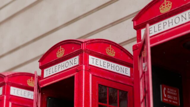 Seamless looping animation with red phone booths on the wall background.