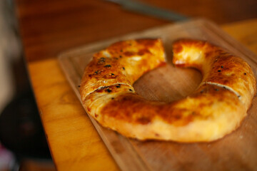 Bread in the kitchen. Fresh pastries. Ruddy dough.