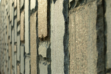 Granite wall texture. Stonework. Details of urban architecture.