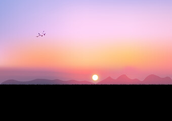 graphics image sunset and light orange silhouette of sunset with dark grass on the ground