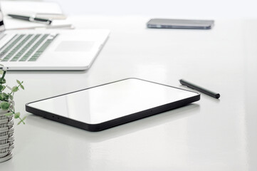 Closeup view of blank screen portable tablet on white tablet.
