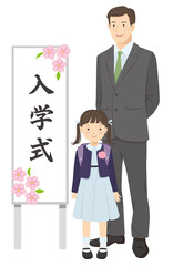 入学式の看板の横に立つお父さんと女の子