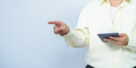 man hold tablet and point left white copy space background