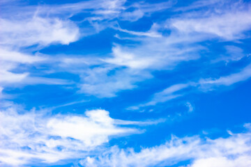 Blue sky clouds in an abstract style on a light background. Nature landscape background. Abstract bright wallpaper. Blue color. Abstract bright wallpaper.
