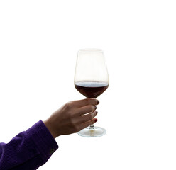 hand holding wine glass in vineyard