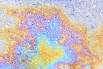 puddle gasoline background, wet oil multicolored rainbow pollution spill