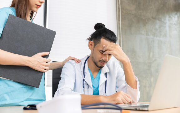 Team of asian doctors and businesswoman having a meeting in medical office.Closeup portrait, young depressed woman healthcare  in despair, isolated hospital.