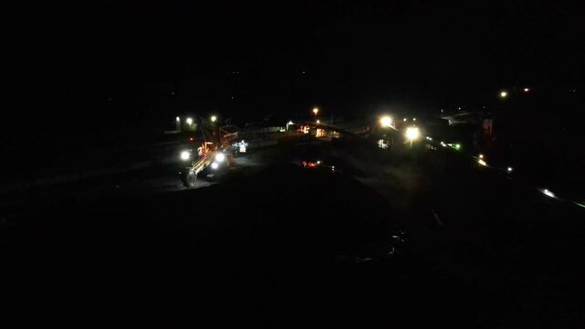 Coal transshipment at night. View from above. Coal transshipment station at an open pit.